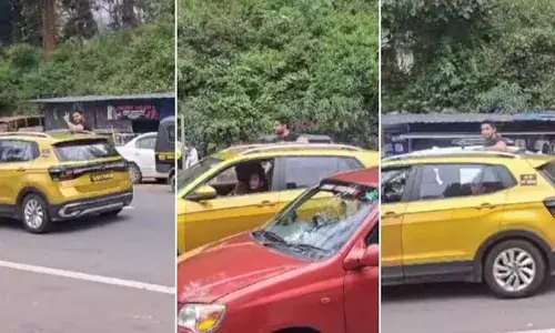 മൂന്നാറിലെ ഗ്യാപ് റോഡില്‍ വീണ്ടും സാഹസികയാത്ര; കാറിന്റെ വാതിലില്‍ ഇരുന്ന് യാത്ര ചെയ്ത് യുവാവ്: ദൃശ്യങ്ങള്‍ പകര്‍ത്തി നാട്ടുകാര്‍