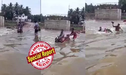 കൗതുകം ലേശം കൂടുതലാ..; കുത്തിയൊഴുകുന്ന വെള്ളത്തിലൂടെ ബൈക്ക് യാത്രക്കാരന്റെ സാഹസികയാത്ര; അണ്ണന്.. ഇതൊക്കെ എന്തെന്ന് കണ്ടുനിന്നവർ; പാതിവഴി എത്തിയപ്പോൾ കളി മാറി; കുത്തൊഴുക്കിൽ ബൈക്ക് പെട്ടു; ഒഴിഞ്ഞുമാറി തൂണിൽ പിടിച്ച് രക്ഷപ്പെട്ടു; തലയിൽ കൈവച്ച് നാട്ടുകാർ!