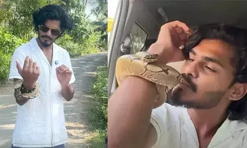 അപൂര്‍വയിനം പെരുമ്പാമ്പിനെ കയ്യില്‍ ചുറ്റിയും വാഹനമോടിച്ചും യുട്യൂബര്‍; വീഡിയോ വൈറലായതിന് പിന്നാലെ സംഭവത്തില്‍ ഇടപെട്ട് വനംവകുപ്പ്