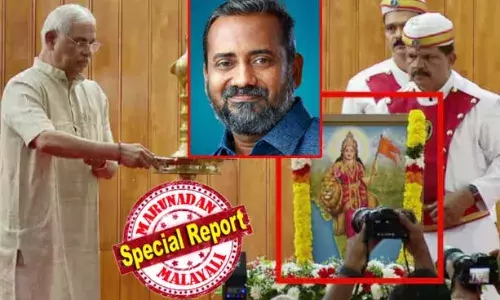 വേദിയില്‍ ആര്‍.എസ്.എസ് ഉപയോഗിക്കുന്ന ഭാരതാംബയുടെ ചിത്രം; ഈ ചിത്രത്തില്‍ പുഷ്പാര്‍ച്ചന വേണമെന്ന് നിര്‍ബന്ധം പിടിച്ച് രാജ്ഭവന്‍; പറ്റില്ലെന്ന് കൃഷിവകുപ്പ്; പരിസ്ഥിതി ദിനാഘോഷം ബഹിഷ്‌ക്കരിച്ച് കൃഷി മന്ത്രി പി പ്രസാദ്; പരിസ്ഥിതി ദിന സെക്രട്ടറിയേറ്റ് അങ്കണത്തിലെ ദര്‍ബാര്‍ ഹാളിലേക്ക് മാറ്റി