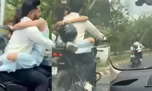 ഇന്ധനടാങ്കിന് മുകളിലിരുന്ന് കെട്ടിപ്പിടിച്ച് കാമുകി; സാഹസികമായി ബൈക്കോടിച്ച് യുവാവ്; കാറിലെ യാത്രക്കാന്‍ പകര്‍ത്തിയ ദൃശ്യം വൈറലായതോടെ 53,500 രൂപ പിഴ