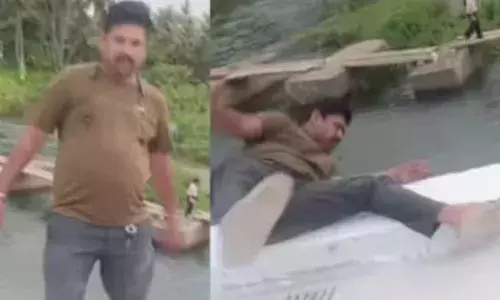 പാലത്തിന് മുകളിലിരുന്ന് ഫോട്ടോയെടുക്കാൻ ശ്രമിക്കുന്നതിനിടെ അപകടം; ബാലൻസ് തെറ്റി നദിയിലേക്ക് വീണ് കാണാതായി; യുവാവിനായി തിരച്ചിൽ തുടരുന്നു; പേടിപ്പിച്ച് ദൃശ്യങ്ങൾ