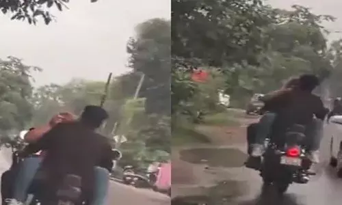 തിരക്കേറിയ റോഡിലൂടെ കുതിക്കുന്ന ബൈക്ക്; യുവതിയെ പെട്രോൾ ടാങ്കില്‍ ഇരുത്തി യുവാവിന്റെ സാഹസിക യാത്ര; കണ്ടുനിന്നവരുടെ കിളി പോയി; പണികൊടുത്ത് പോലീസ്; വൈറലായി വീഡിയോ