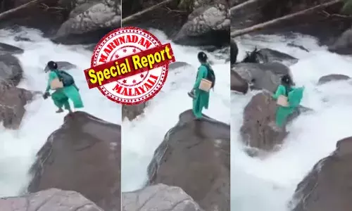 പാറയ്ക്ക് മുകളിൽ പച്ച ചുരിദാർ ധരിച്ച് ഒരു യുവതി; താഴെ നില തെറ്റി കുത്തിയൊഴുകുന്ന അരുവി; പൊടുന്നനെ സാഹസികമായി കുതിച്ചുചാട്ടം; കണ്ടുനിന്നവർ പരിഭ്രാന്തിയിൽ നിലവിളിച്ചു; ഒടുവിൽ സത്യാവസ്ഥ അറിഞ്ഞപ്പോൾ കൈയ്യടി; ദൃശ്യങ്ങൾ വൈറൽ