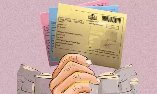 റേഷന്‍ കാര്‍ഡില്‍ ഭാര്യയുടെ ചിത്രത്തിന് പകരം ബിയര്‍ കുപ്പി; പരാതിയുമായി നിര്‍മ്മാണ തൊഴിലാളി