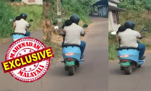 തോളിൽ കിടന്ന് ഉറങ്ങുന്ന കുഞ്ഞുമായി ഇലക്ട്രിക് സ്‌കൂട്ടറിൽ അപകട യാത്ര; ഒരു കയ്യിൽ കുഞ്ഞിനെ പിടിച്ചിരിക്കുന്നയാളിന്റെ മറു കൈയിൽ വാഹനത്തിന്റെ ഹാൻഡിൽ; ചെറിയൊരു അശ്രദ്ധ പോലും ദുരന്തമായേനെ; അടൂരിലേത് അപകടകരമായ യാത്ര തന്നെ; നടപടിക്കൊരുങ്ങി മോട്ടോർ വാഹന വകുപ്പ്; കുട്ടിയെ തോളിൽ കിടത്തി അപകട യാത്ര നടത്തിയത് അച്ഛനോ ?