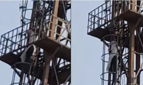 ദേഷ്യം സഹിക്കാൻ വയ്യാതെ ഓടി വന്ന് മൊബൈൽ ടവറിന് മുകളിലേക്ക് ചാടിക്കയറിയ യുവതി; താഴെ അനുനയിപ്പിക്കാൻ ശ്രമിക്കുന്ന നാട്ടുകാർ; പോലീസ് എത്തിയപ്പോൾ അറിഞ്ഞത് മറ്റൊന്ന്