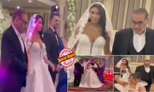 നഗ്നമായ ചുമലുകളും മാറിടം പാതി പുറത്തുകാട്ടുന്ന സ്ട്രാപ്പില്ലാത്ത പാശ്ചാത്യ ഗൗണും ധരിച്ച് വധു; ആനയിക്കുന്നത് ഹിജാബ് ധരിക്കാത്തതിന് മെഹ്‌സ അമിനിയെ തല്ലിക്കൊന്ന ആയത്തൊള്ള ഖമേനിയുടെ ഉപദേഷ്ടാവും; ഇറാനില്‍ സാധാരണ സ്ത്രീകള്‍ ശിരോവസ്ത്രം ധരിച്ചില്ലെങ്കില്‍ ചാട്ടവാറടിയും വധശിക്ഷയും വരെ; ഭരണകൂടത്തിന്റെ ഹിപോക്രസിക്ക് എതിരെ ജനരോഷം