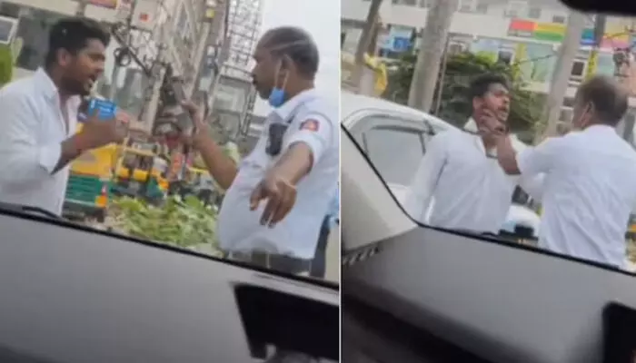പോലീസുകാരനോട് തർക്കിച്ച് നിൽക്കുന്ന ടാക്സി ഡ്രൈവർ; കോളറിന് കയറി പിടിച്ച് തള്ളി ബഹളം; നടുറോഡിലെ കൈവിട്ട കളി വൈറൽ; എന്തൊക്കെ കാണണമെന്ന് കമെന്റുകൾ പോലീസുകാരനോട് തർക്കിച്ച് നിൽക്കുന്ന ടാക്സി ഡ്രൈവർ; കോളറിന് കയറി പിടിച്ച് തള്ളി ബഹളം; നടുറോഡിലെ കൈവിട്ട കളി വൈറൽ; എന്തൊക്കെ കാണണമെന്ന് കമെന്റുകൾ