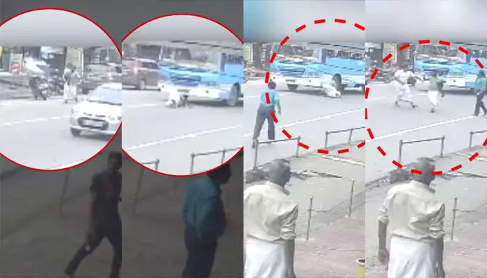 റോഡരികിലൂടെ മകനെയും എടുത്ത് ഓടി വന്ന പിതാവ്; പൊടുന്നനെ സ്വകാര്യ ബസിന് മുന്നിലേക്ക് എടുത്ത് ചാടി; രക്ഷപ്പെട്ടത് തലനാരിഴക്ക് റോഡരികിലൂടെ മകനെയും എടുത്ത് ഓടി വന്ന പിതാവ്; പൊടുന്നനെ സ്വകാര്യ ബസിന് മുന്നിലേക്ക് എടുത്ത് ചാടി; രക്ഷപ്പെട്ടത് തലനാരിഴക്ക്