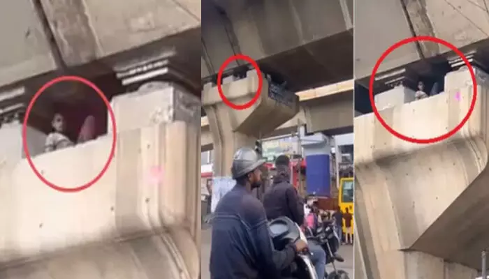 വീട്ടിലെ കട്ടിലിൽ സുഖമായി കിടക്കുന്ന പോലെ ഫ്ലൈഓവർ തൂണിനുള്ളിൽ ദേ..ഒരാൾ; കാലിന്മേൽ കാല് കയറ്റി വച്ച് പോകുന്നവരെയെല്ലാം നോക്കിയിരിപ്പ്; യാരാടാ...സാമി ഇവനെന്ന് നെറ്റിസൺസ്