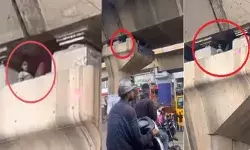 വീട്ടിലെ കട്ടിലിൽ സുഖമായി കിടക്കുന്ന പോലെ ഫ്ലൈഓവർ തൂണിനുള്ളിൽ ദേ..ഒരാൾ; കാലിന്മേൽ കാല് കയറ്റി വച്ച് പോകുന്നവരെയെല്ലാം നോക്കിയിരിപ്പ്; യാരാടാ...സാമി ഇവനെന്ന് നെറ്റിസൺസ്