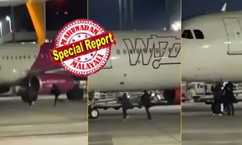 അയ്യോ..പോവല്ലേ ആള് കേറാൻ ഉണ്ടേ..!!; ബസ് സ്റ്റാൻഡിലേക്ക് കയറിവരുന്ന അതെ ലാഘവത്തോടെ നിർത്തിയിട്ടിരുന്ന ഭീമൻ വിമാനത്തിന് അരികിലേക്ക് ഓടുന്ന രണ്ടുപേർ; കൈവീശി കാണിച്ചുകൊണ്ട് അപേക്ഷ; യാത്രക്കാരുടെ പ്രവർത്തിയിൽ എയർപോർട്ട് മുഴുവൻ പരിഭ്രാന്തി; ഒടുവിൽ സത്യാവസ്ഥ പുറത്ത്