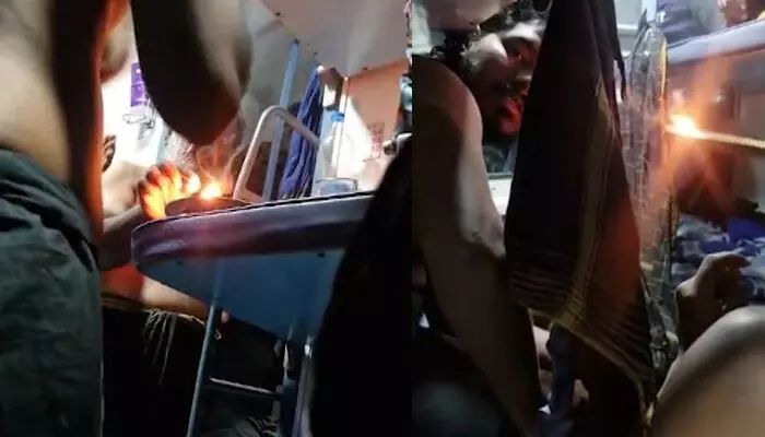 ട്രെയിനിലെ സ്ലീപ്പര് കോച്ചില് കര്പ്പൂരം കത്തിച്ച് പ്രാര്ത്ഥന നടത്തി ശബരിമല തീര്ത്ഥാടകര്; ദൃശ്യങ്ങള് പുറത്ത് ട്രെയിനിലെ സ്ലീപ്പര് കോച്ചില് കര്പ്പൂരം കത്തിച്ച് പ്രാര്ത്ഥന നടത്തി ശബരിമല തീര്ത്ഥാടകര്; ദൃശ്യങ്ങള് പുറത്ത്