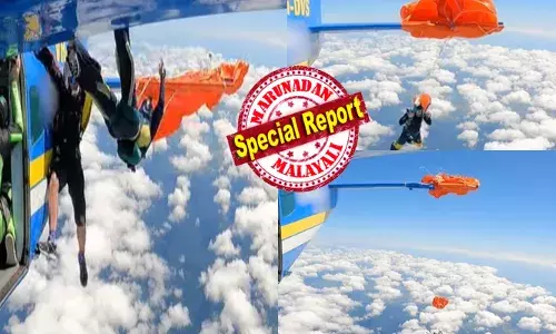 കടുംനീല വിരിച്ച ആകാശത്തിലൂടെ പറക്കുന്ന വിമാനം; 15,000 അടി ഉയരത്തിൽ ജീവൻ പണയം വച്ച് എടുത്തുചാടാൻ റെഡിയായി നിൽക്കുന്ന സ്കൈഡൈവർമാർ; പെട്ടെന്ന് ഒരു വശത്ത് മാറി നിന്നൊരാൾ കാറ്റത്ത് പറന്നുപോകുന്ന അതിഭീകര കാഴ്ച; കുറച്ചുനേരം ഫ്ലൈറ്റിന്റെ വാലിൽ തൂങ്ങിക്കിടന്ന് നേരെ താഴേയ്ക്ക്; എല്ലാം കണ്ട് സ്തംഭിച്ചുപോയ പൈലറ്റ് ചെയ്തത്