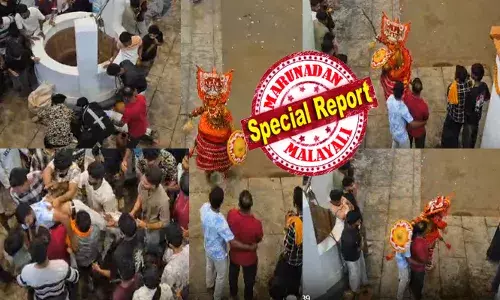 ക്ഷേത്ര നടയിലൂടെ കൈയ്യിൽ പരിചയും വാളുമേന്തി വരുന്ന തെയ്യത്തിനെ കണ്ടതും ഫുൾ എനെർജിറ്റിക്കായ യുവാവ്; ഒരാളുടെ മറവിൽ നിന്ന് ആർപ്പുവിളിച്ച് ബഹളം; കുറച്ച് നേരം നോക്കി നിന്ന ശേഷം പൂമാരുതന്റെ വക അനുഗ്രഹം; മുഷ്ടി ചുരുട്ടി കറങ്ങിയുള്ള ഇടിയിൽ ബോധം പോയി; ചർച്ചയായി വീഡിയോ