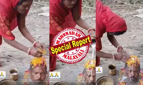 ഭർത്താവിനെ കഴുത്തറ്റം മണ്ണിൽ കുഴിച്ചിട്ടു, തലയിൽ പാലും പൂവും; ആചാരമോ അതോ ശുദ്ധ മണ്ടത്തരമോ?; സോഷ്യൽ മീഡിയയിൽ വൈറലായി വിചിത്ര പൂജ; ഇത് മറ്റ് ഭാര്യമാർ കാണാതിരുന്നാൽ മതിയായിരുന്നു എന്ന് ഭർത്താക്കന്മാർ