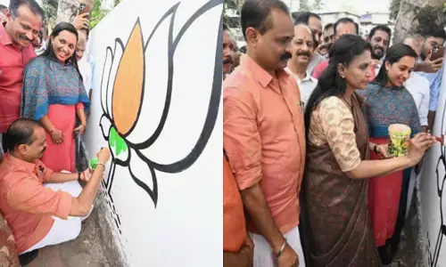 ചുവരിലെ താമരയ്ക്ക് നിറം നൽകുന്ന മേയർ; ഒപ്പം ഡബിൾ ഹാപ്പിയായി ആശാനാഥ്; ഭരണ മാറ്റത്തിന് ജനങ്ങള്‍ കൊതിക്കുന്നുവെന്ന് ശ്രീലേഖ; വട്ടിയൂര്‍ക്കാവിൽ സജീവമായി നേതാക്കൾ